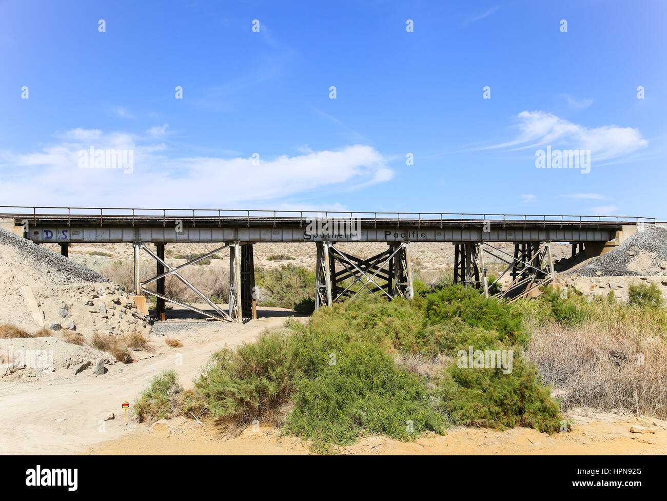 Durmid, California, USA - May 26, 2015: Rail bridge next to California State Route 111 with the logo of the former railroad company Southern Pacific. Stock Photo