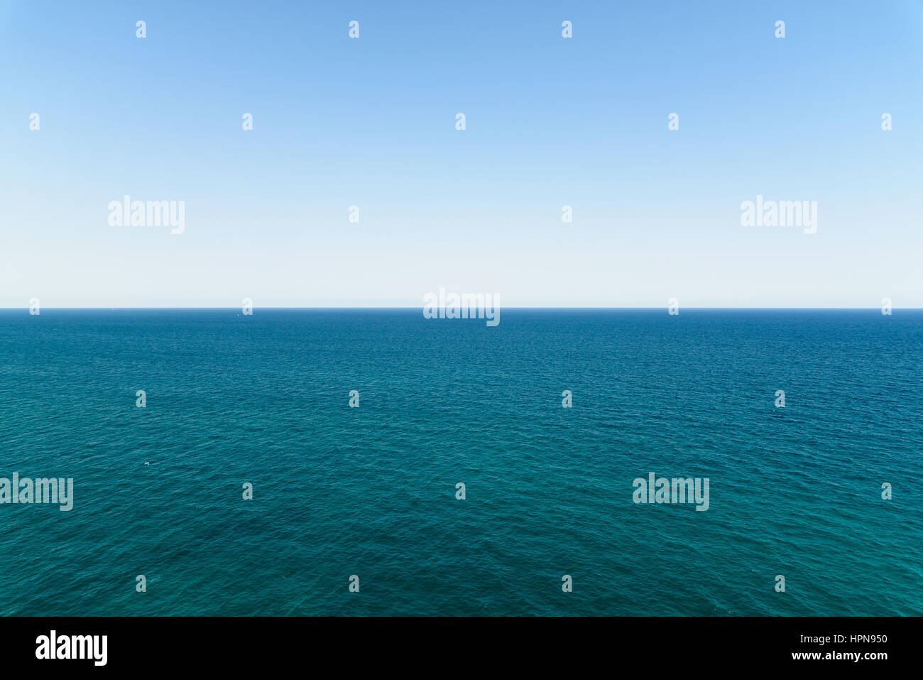 Calm Ocean Water And Clear Blue Sky Stock Photo - Alamy