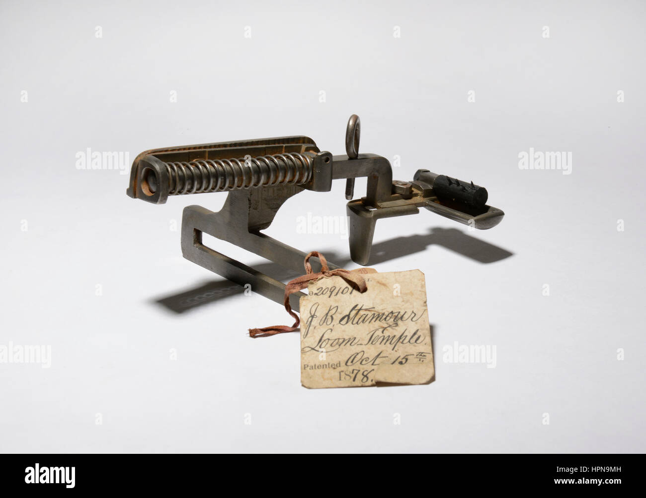 Patent model of an improved Loom-temple machine invented by J. B. Stamour, granted US Patent number 209101 on October 15, 1878. Stock Photo
