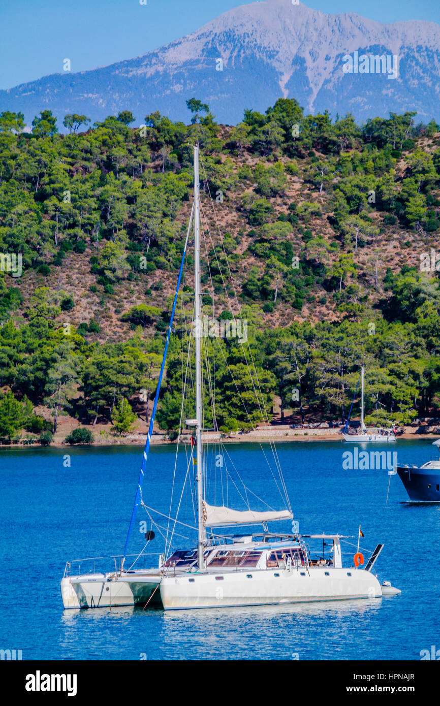 Katamaran cruising in tranquil bay, katamaran, tekne,bareboat cruising,cruising the turkish coast Stock Photo