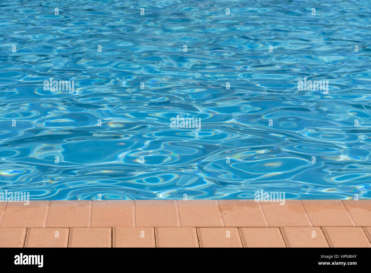 Swimming pool surface on a sunny summer day Stock Photo