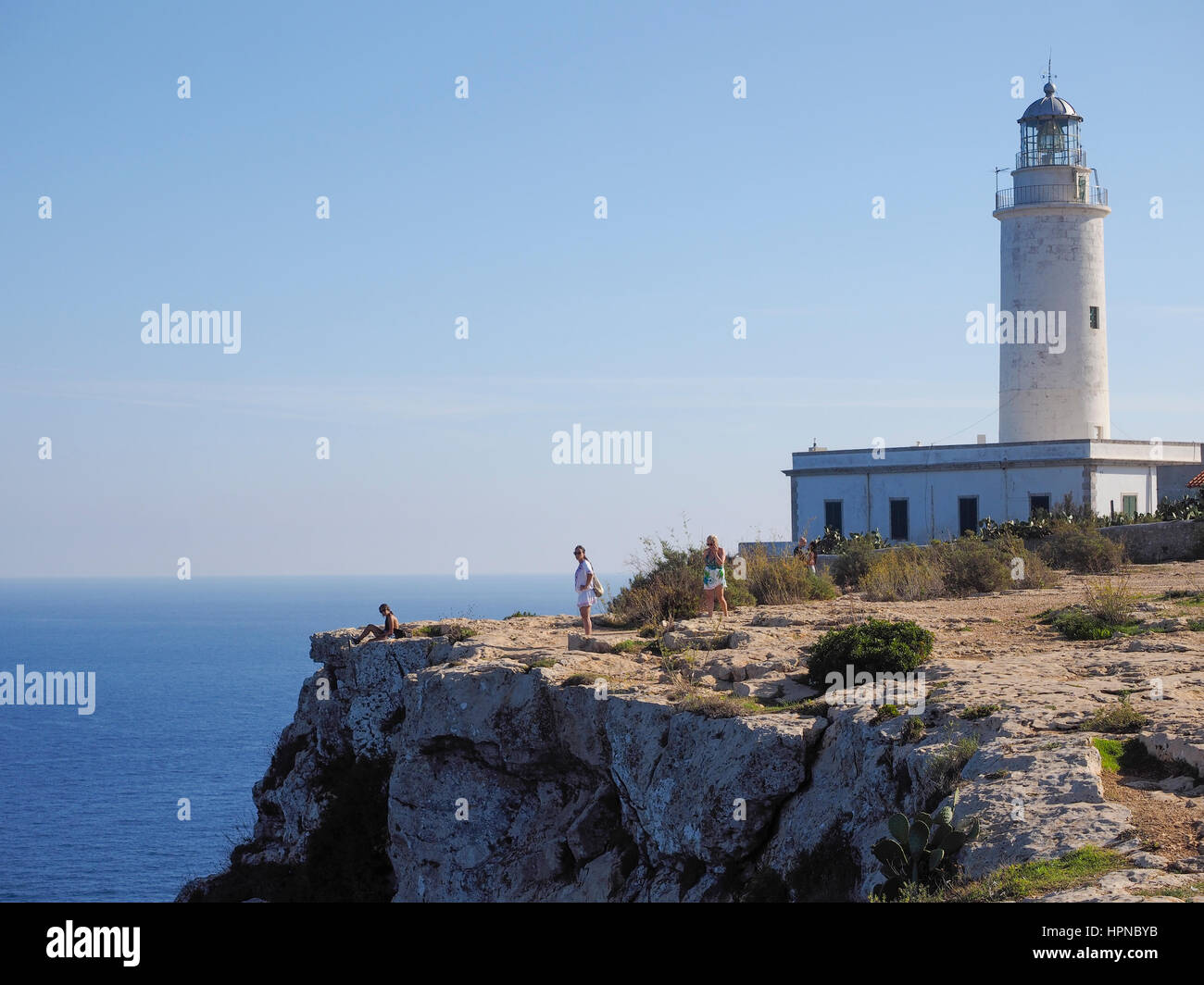 Lighthouse and Flora and fauna on El Pilar de la La Savina Fomentera Spain Balearic island Stock Photo