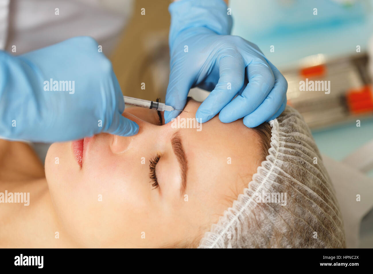 Injections under the skin. The injection the skin above the eyebrow