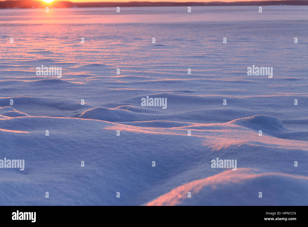 Sunny christmas scene. Winter sun shine on  snowdrifts. Blured winter backdrop. Stock Photo