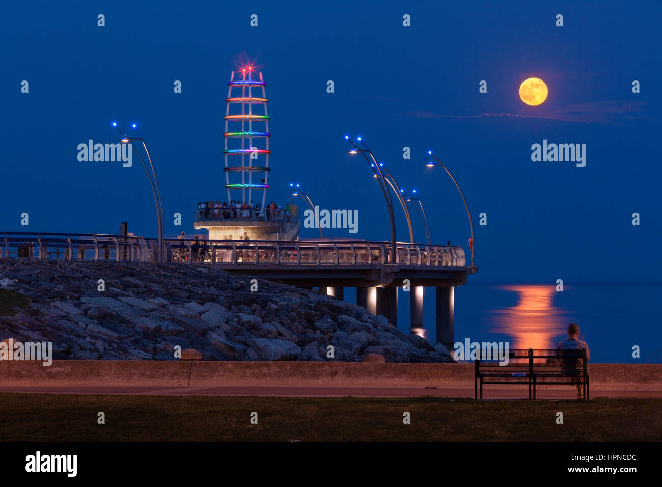 The Brant Street Pier with a full moon supermoon in downtown, Burlington, Ontario, Canada. Stock Photo