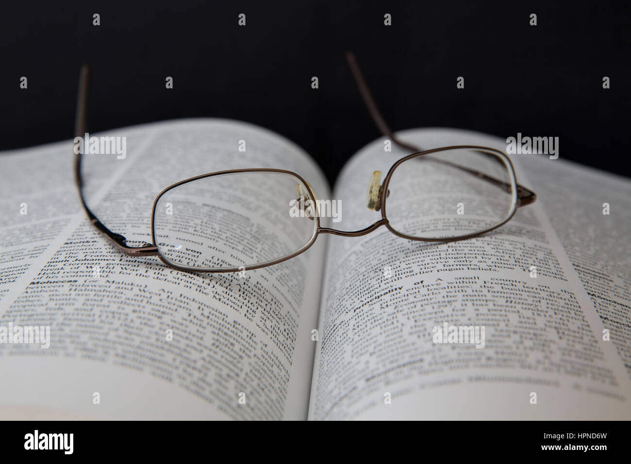Old Book with Spectacles/Reading Glasses Stock Photo
