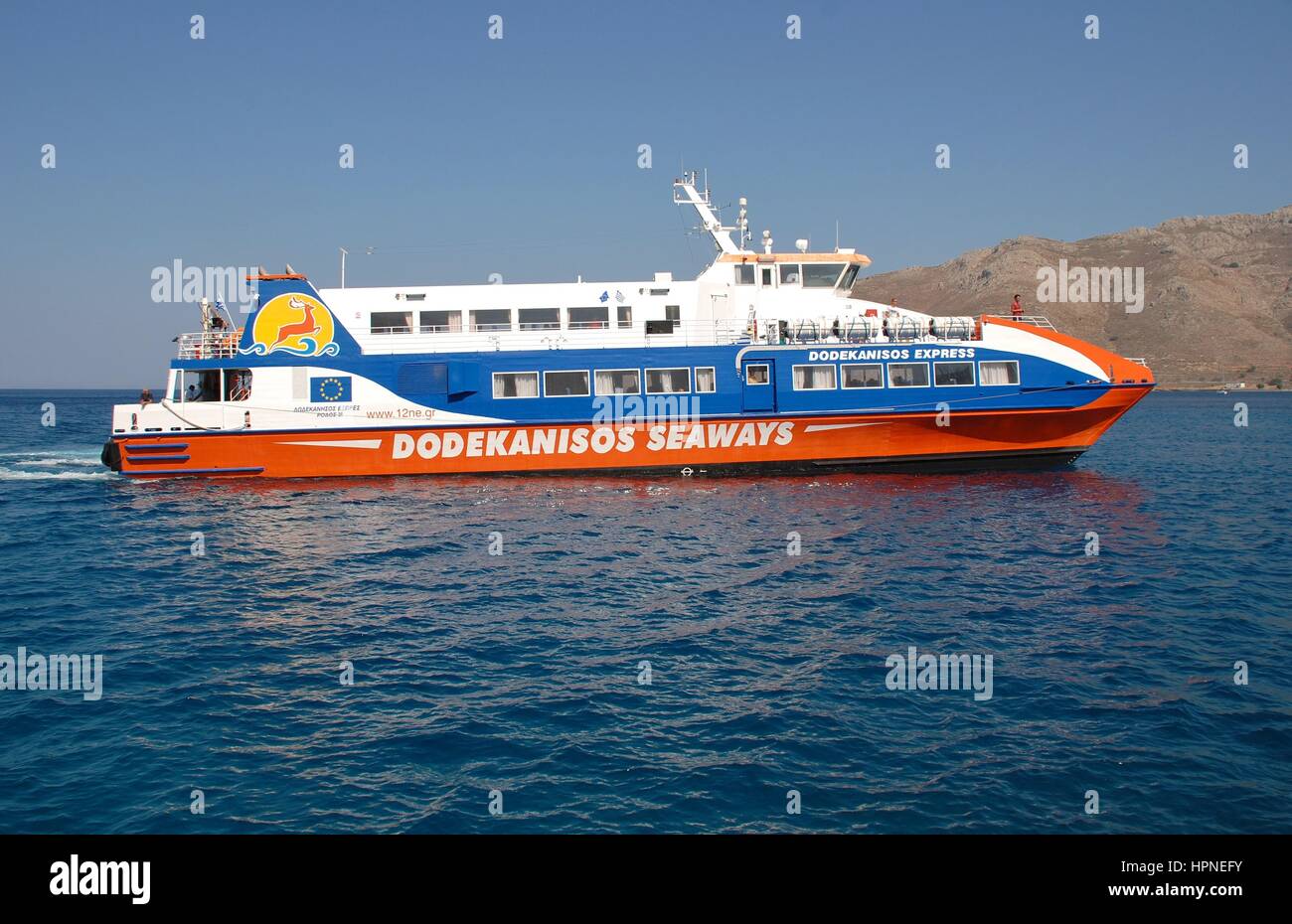 Dodekanisos Seaways catamaran ferry Dodekanisos Express arriving at the Greek island of Tilos on July 19, 2016. The vessel was built in 2000 in Norway Stock Photo