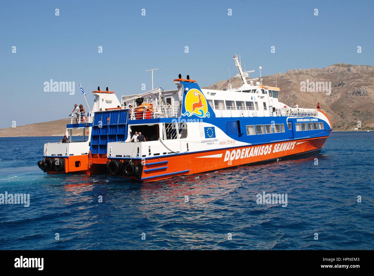 Dodekanisos Seaways catamaran ferry Dodekanisos Express arriving at the Greek island of Tilos on July 19, 2016. The vessel was built in 2000 in Norway Stock Photo