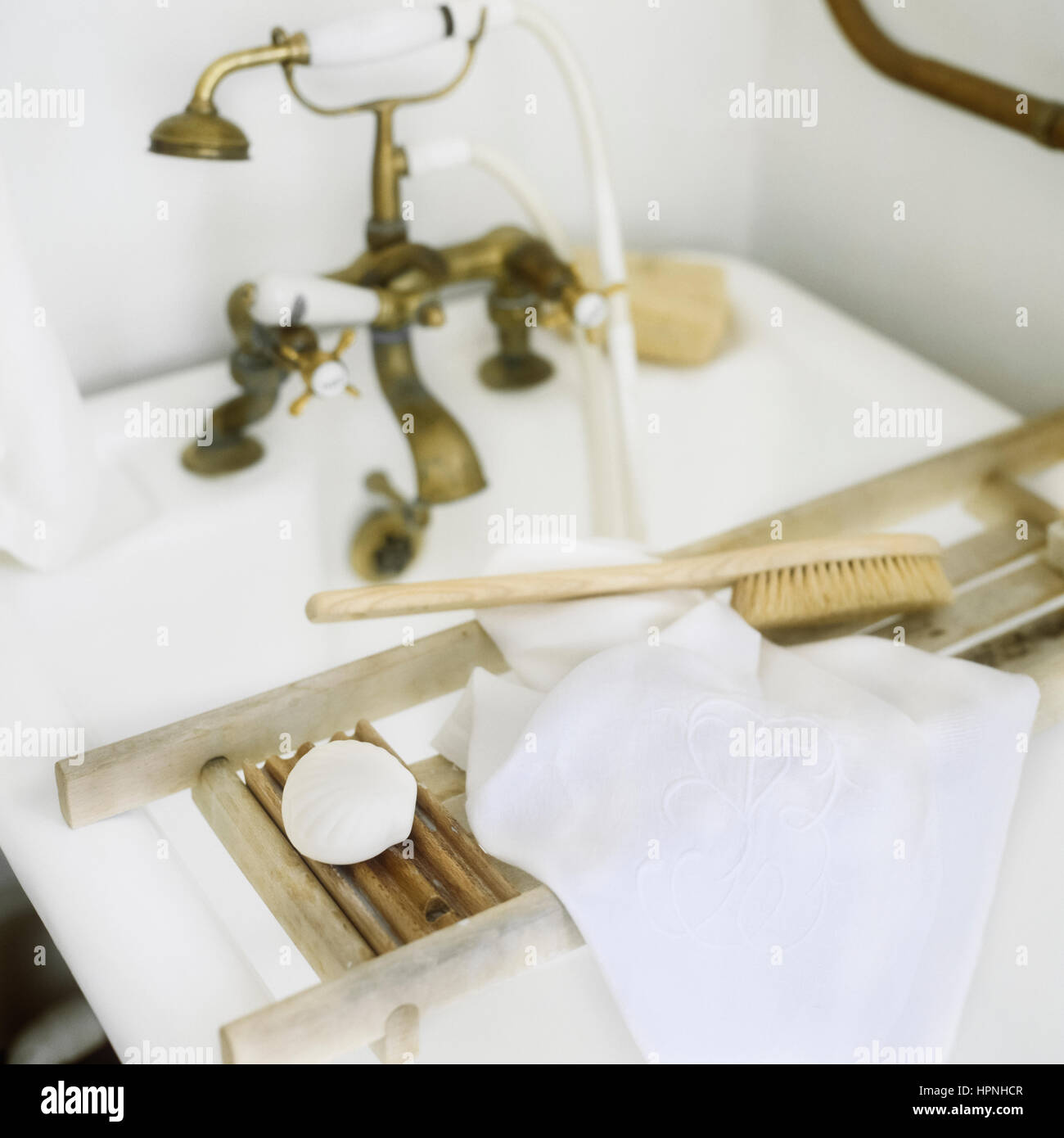 Toiletries on a bathtub rack. Stock Photo