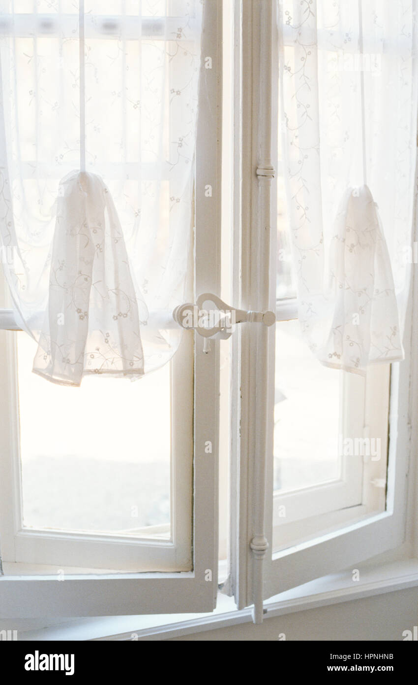 White net curtains on a window Stock Alamy white net curtains on a window HPNHNB