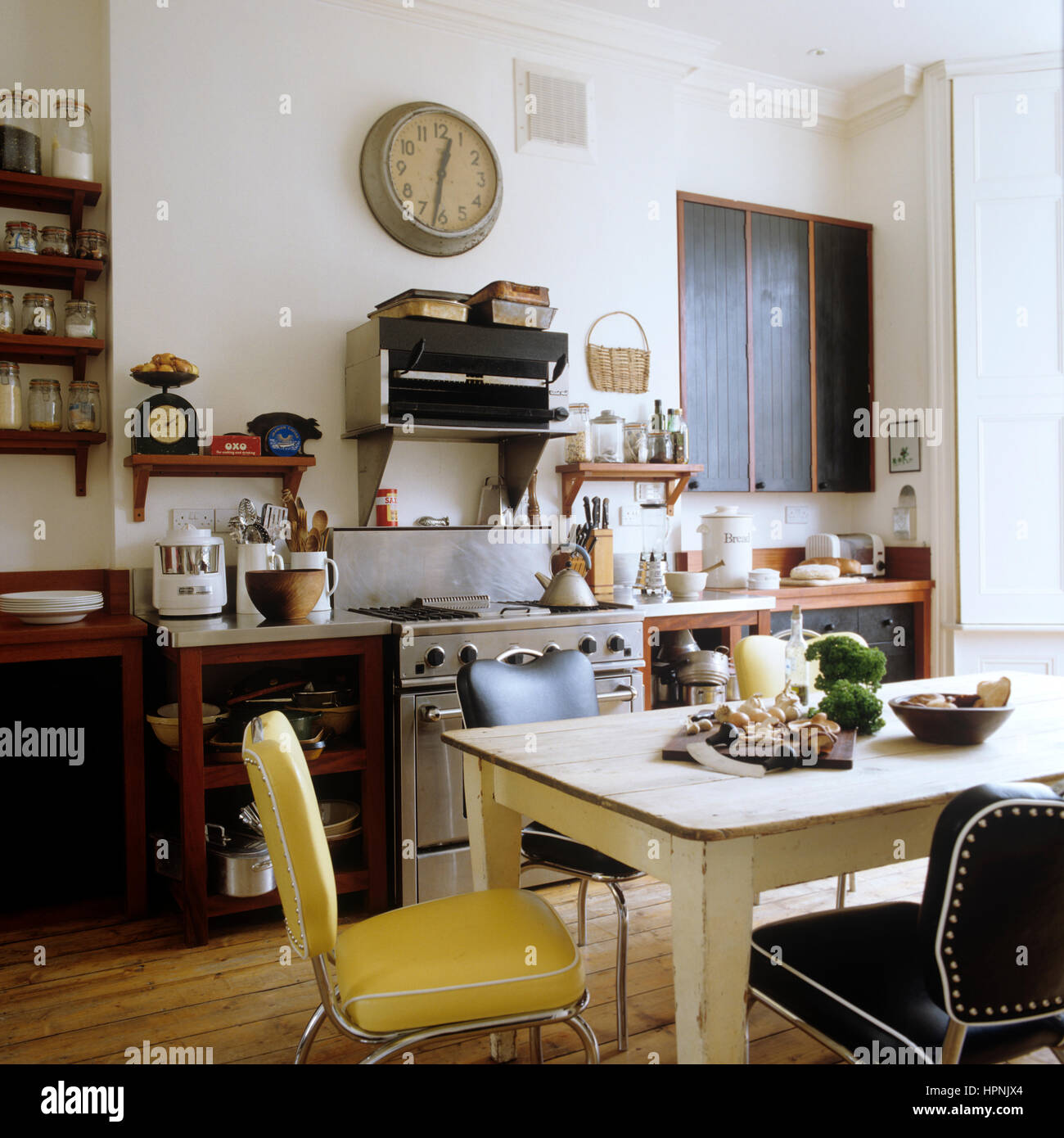 A kitchen with a table and chairs. Stock Photo