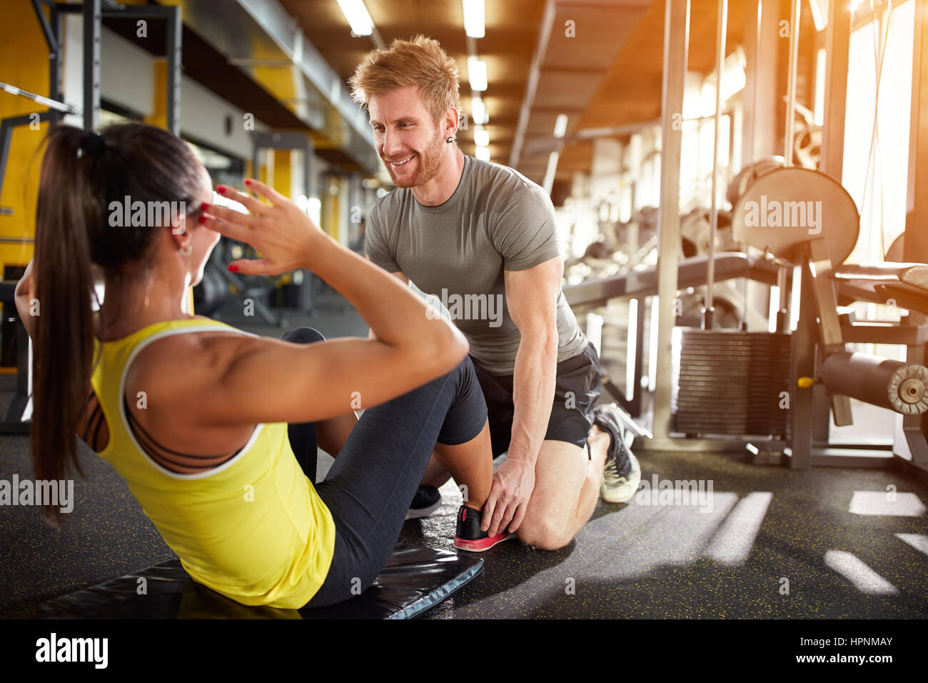 Fitness training with trainer in gym Stock Photo