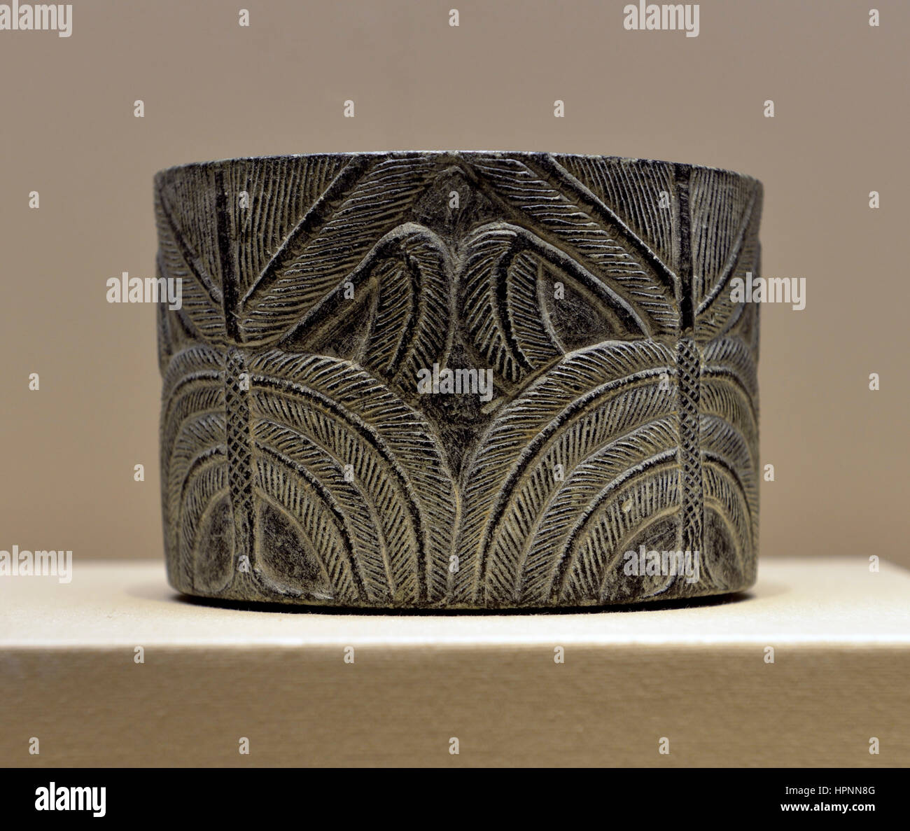 Cylindrical vessel with palm tree. Late 3rd millennium BCE. Chlorite. National Museum, Riyadh. Stock Photo