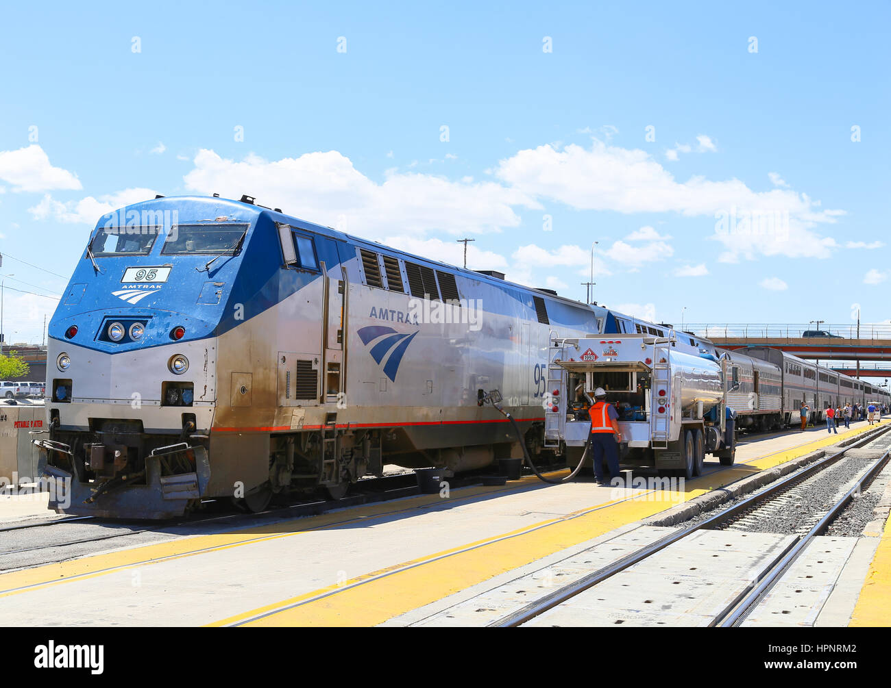 Albuquerque, USA - May 24, 2015: The Amtrak passenger train Southwest Chief being fueled at the station. The tanker is parked next to the engine, seve Stock Photo