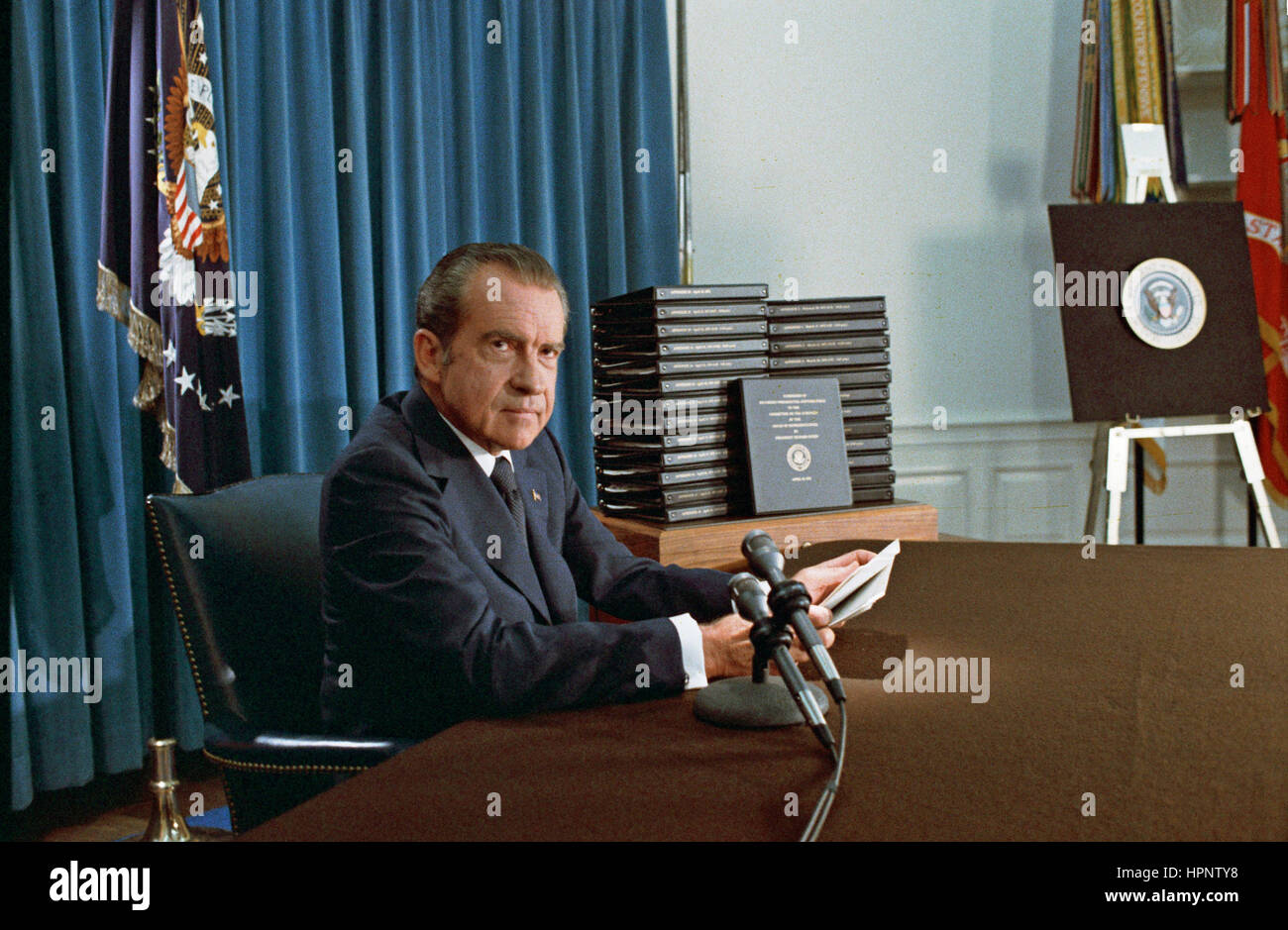 PRESIDENT RICHARD NIXON (1913-1994) with his edited transcripts of the White House Tapes subpoenaed by the Special Prosecutor, during his televised speech  on Watergate  on 29 April 1974. Photo: White House official Stock Photo