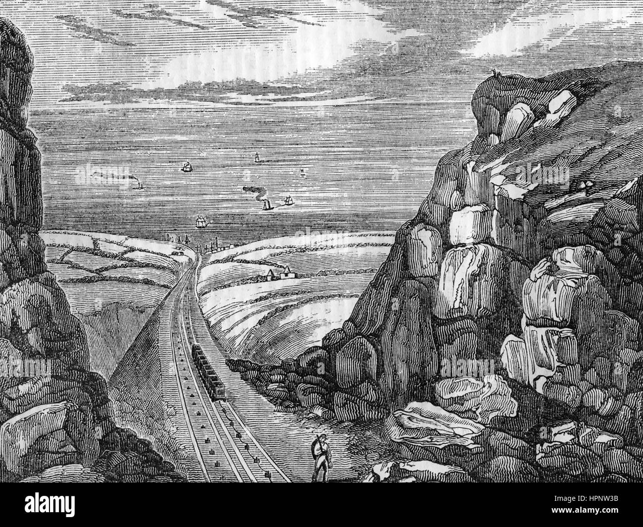 SEAHAM COLLIERY, Durham, England. The railway to Seaham Habour in an 1850 engraving showing empty trucks at right on a pully system  returning uphill to the mines after discharging their loads. Stock Photo