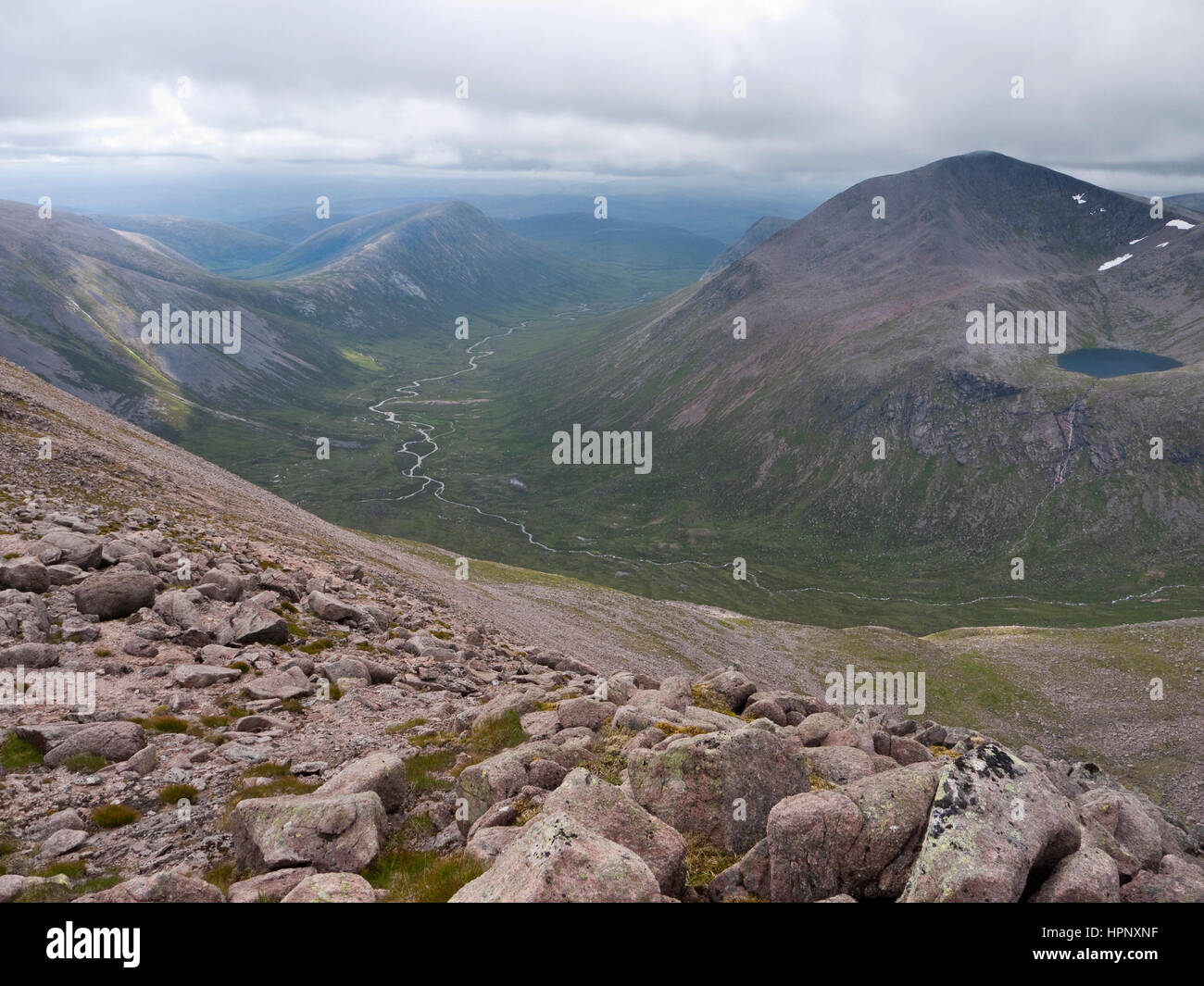 View south down the Lairig Ghru from Ben Macdui, showing Carn a Mhaim & Cairn Toul towering over the River Dee. Lochan Uaine nestles below Cairn Toul Stock Photo