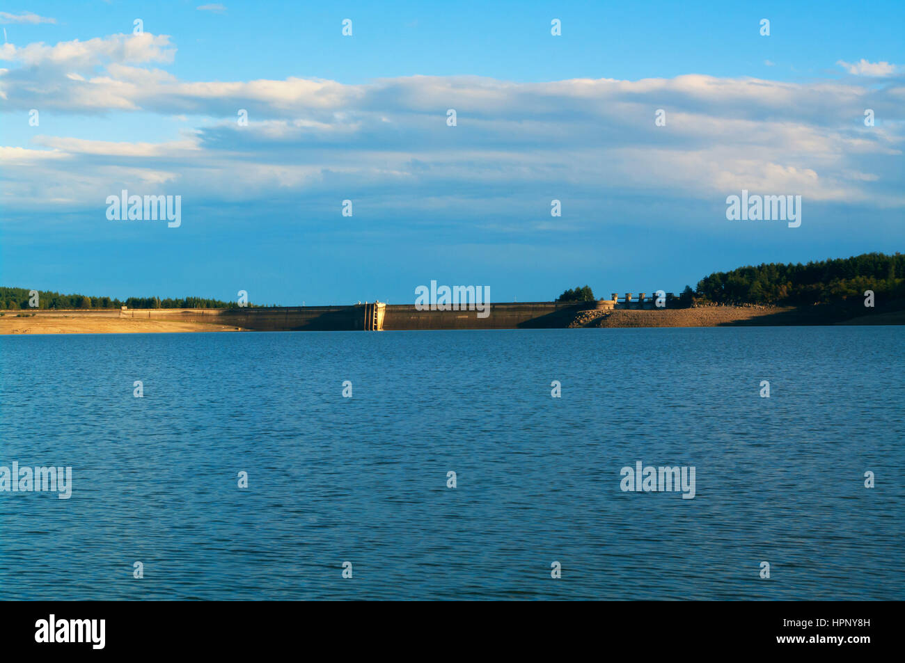 Hydroelectricity. Dam of hydroelectric power plant. Dam reservoir. Water power plant. Stock Photo