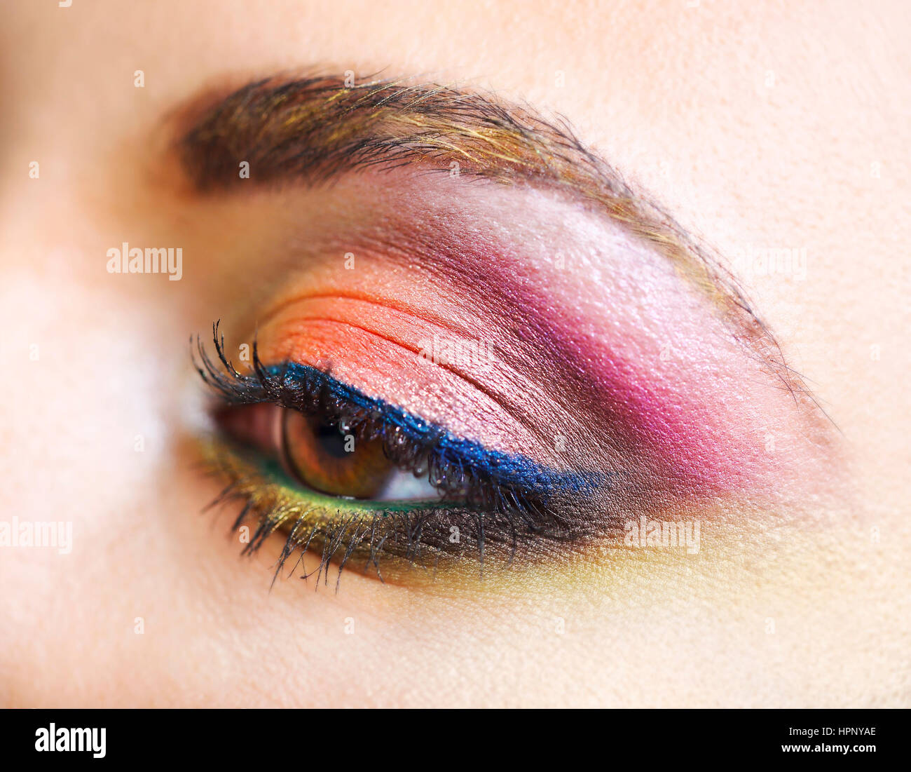 Close up portrait of a beautiful young blond model with bright make up ...