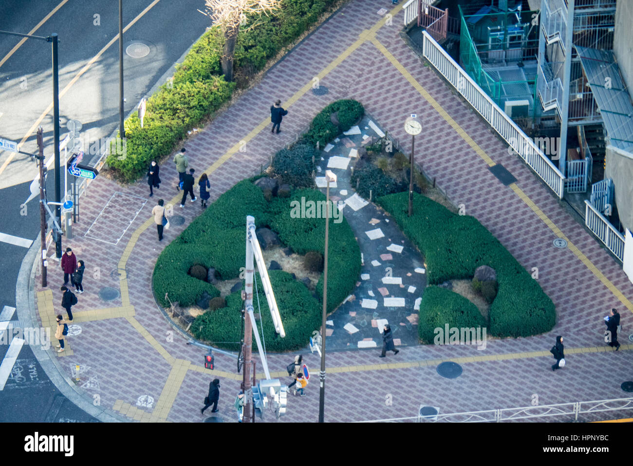 Aerial view of pedestrians at a curved intersection in Bunkyo, Tokyo. Stock Photo