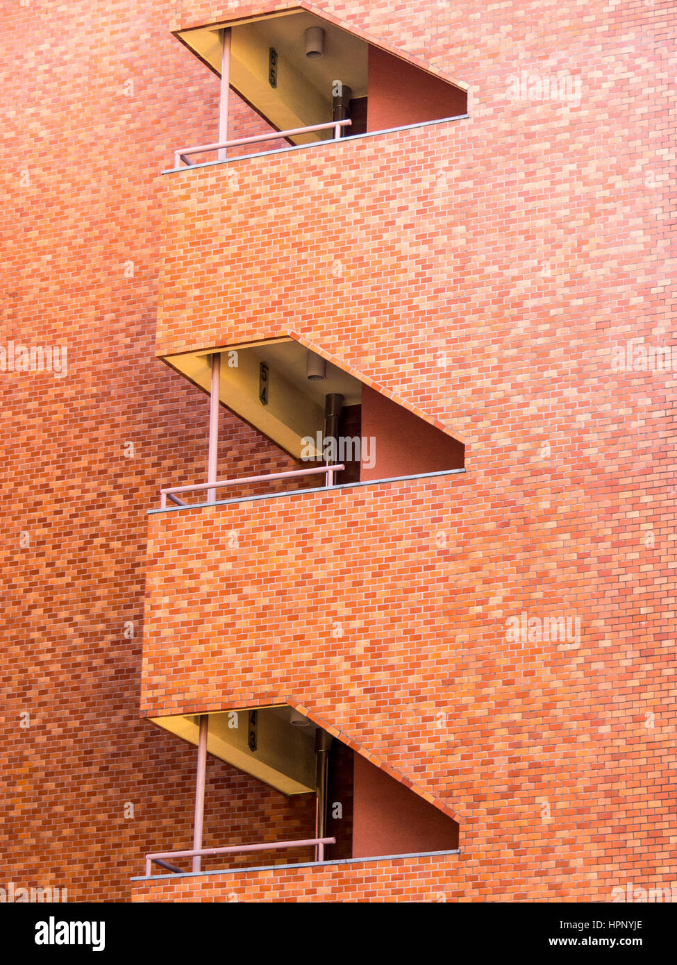 An apartment building featuring stairwell which allows easy access for escape in the event of an earthquake. Stock Photo