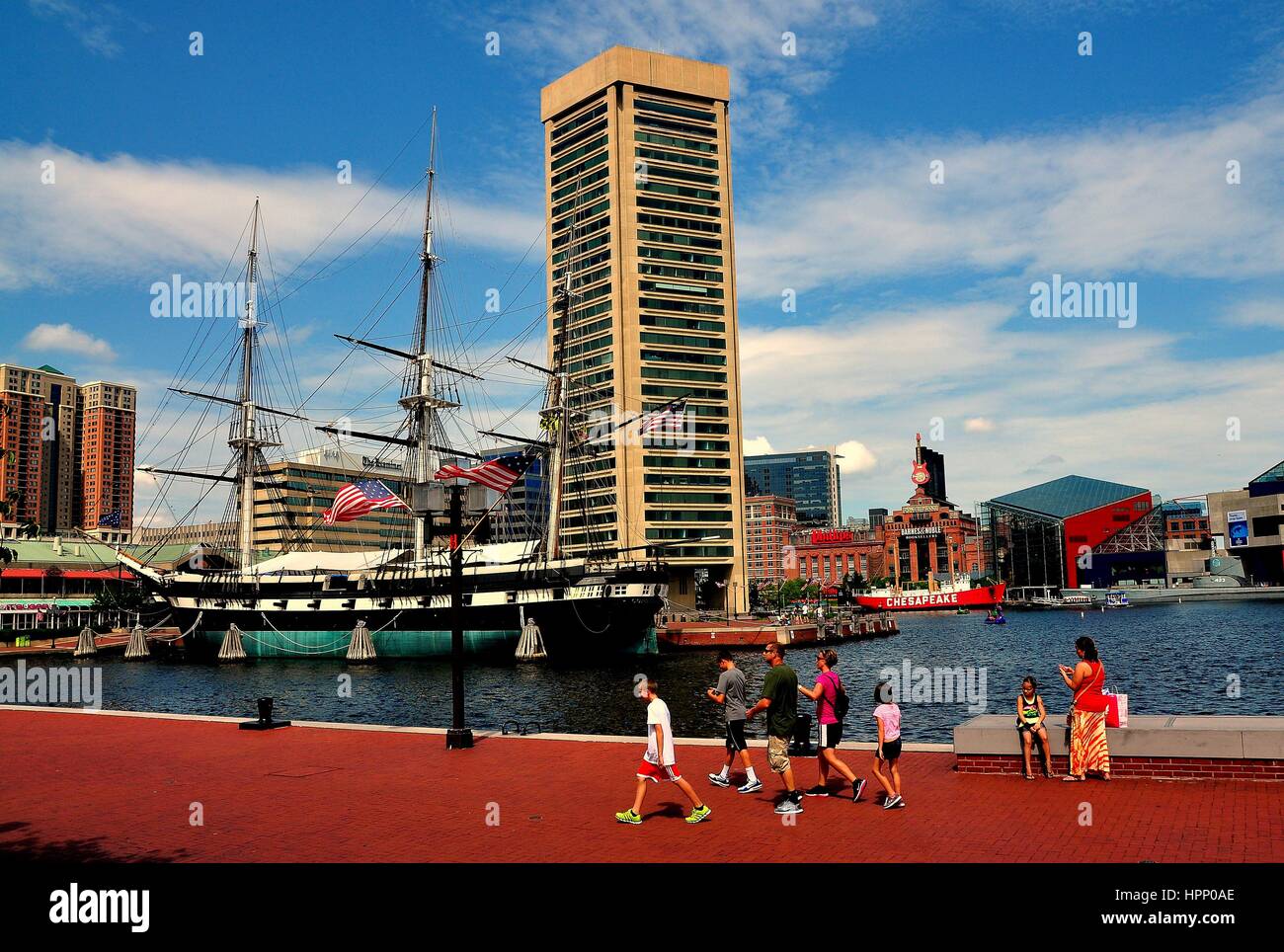 Baltimore, Maryland - July 22, 2013:  The World Trade Center Tower designed by I. M. Pei and 1853 U. S. S. Constitution three masted sailing ship at I Stock Photo