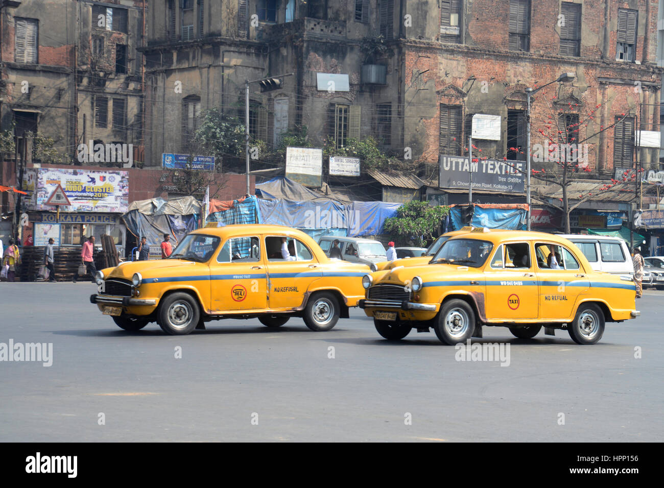 Kolkata, India. 21st Feb, 2017. Ambassador cars through a busy street
