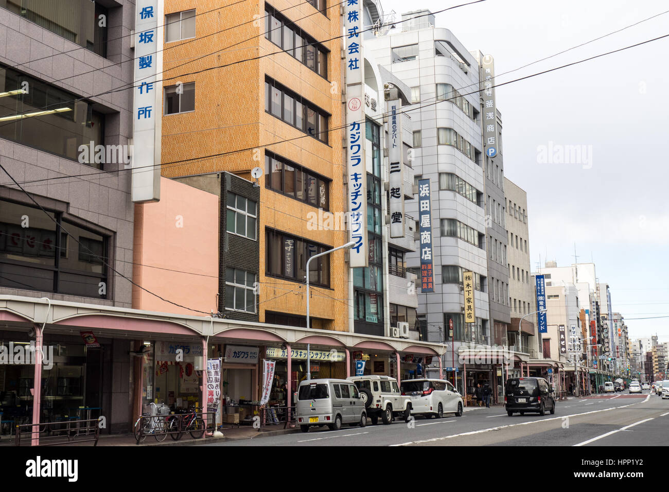 Strip shopping along a busy street in Taito, Tokyo. Stock Photo