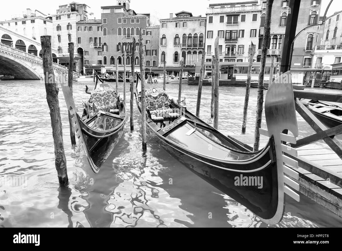 Gondolas on Grand Canal near Realto bridge in Venice, Italy. Black and white Stock Photo