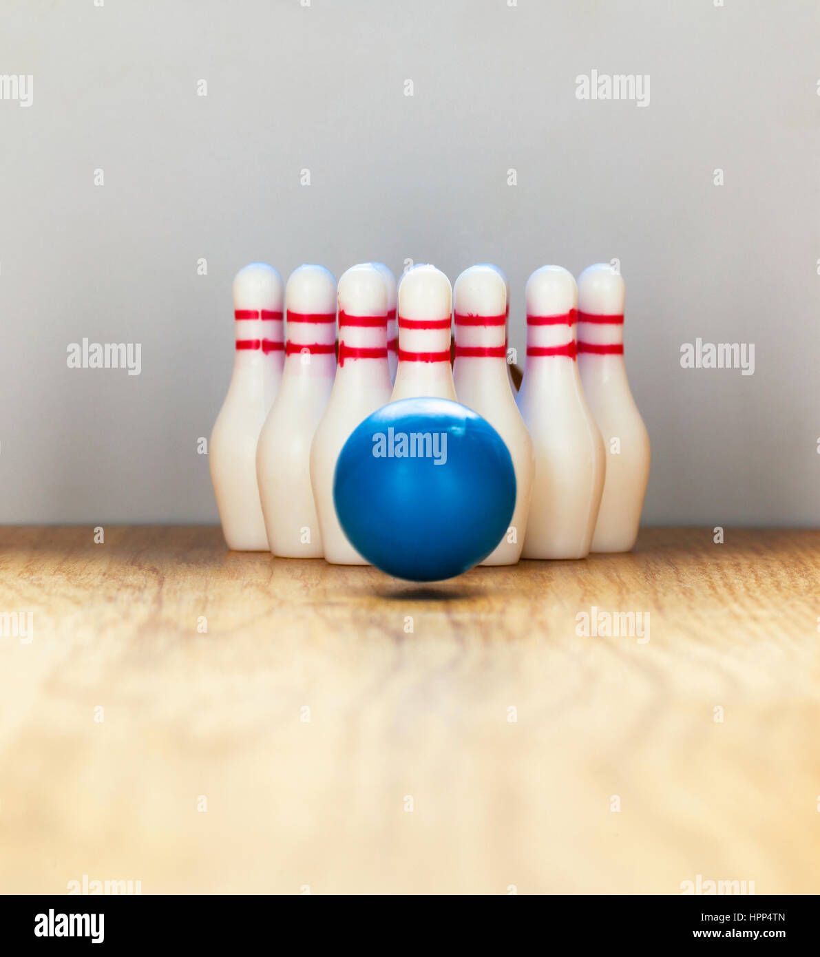 Bowling pins and bowling ball in miniature Stock Photo Alamy