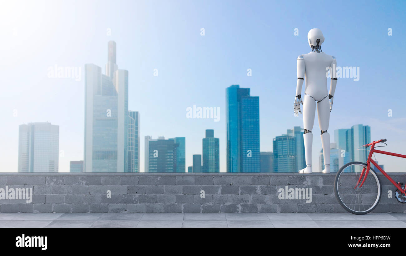 Robot standing on wall looking at skyline Stock Photo