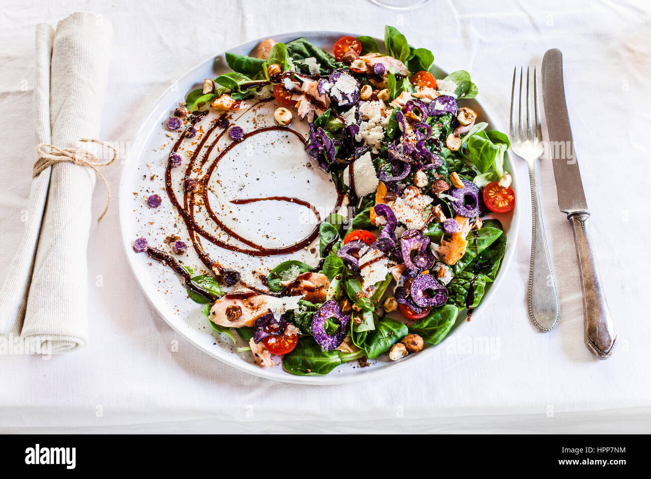 Colourful salad plate with smoked salmon, Crema di Balsamico and hazelnut  oil Stock Photo - Alamy