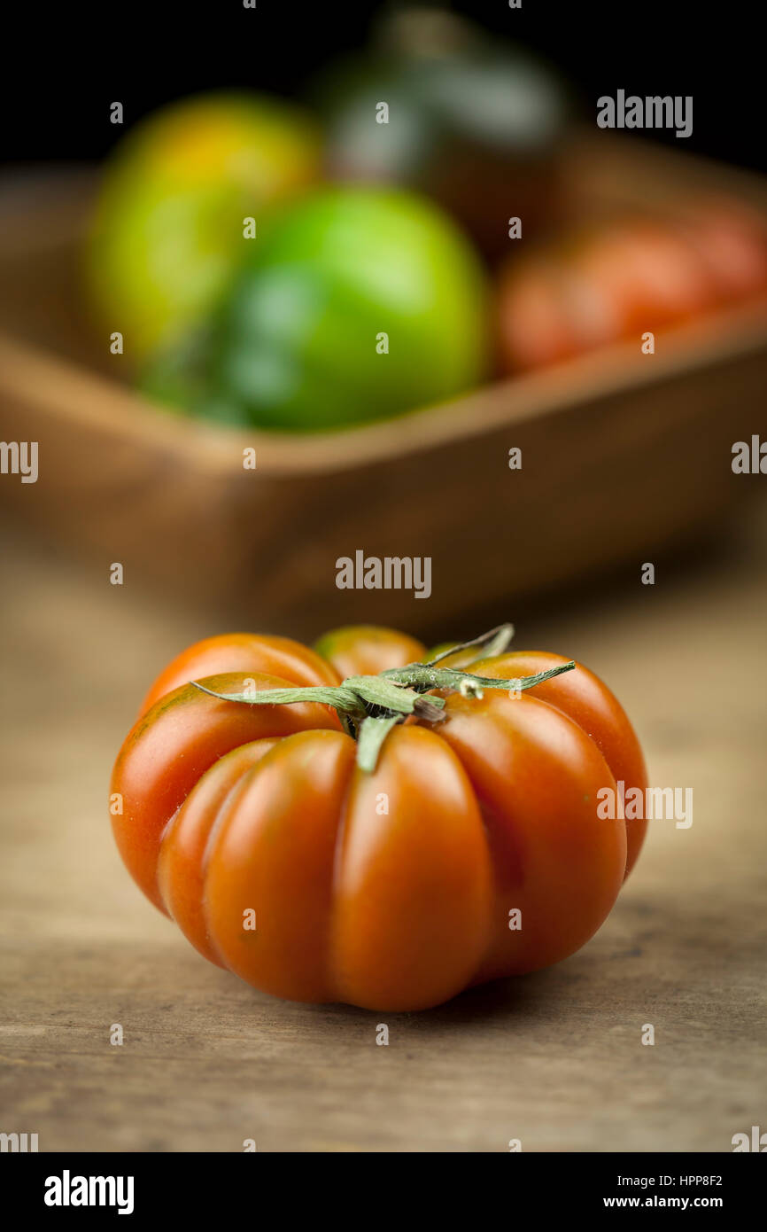 Red Oxheart Tomato on wood Stock Photo
