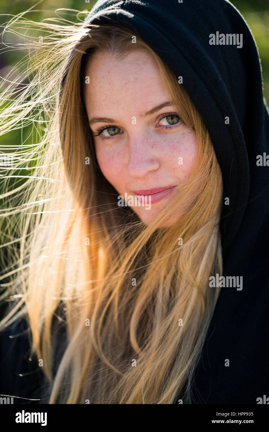 Portrait of smiling young woman outdoors Stock Photo - Alamy