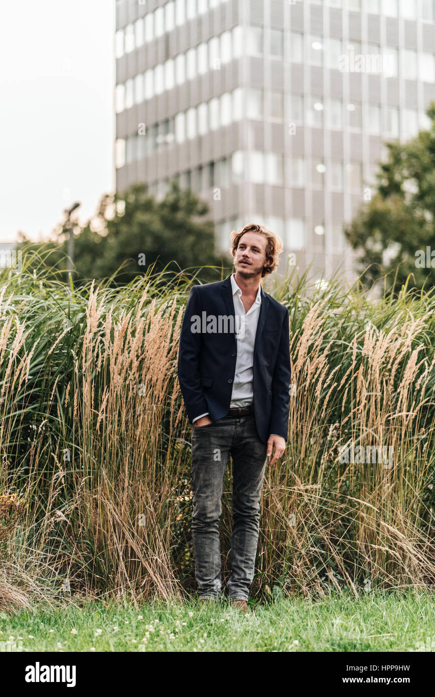 Businessman standing outdoors Stock Photo - Alamy