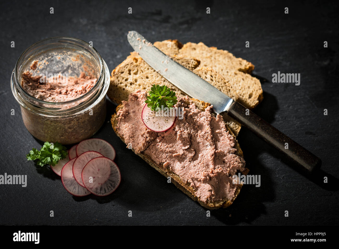 Liverwurst spread on slice of brown bread Stock Photo Alamy