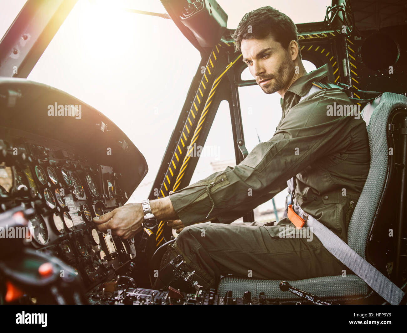 Pilot in cockpit of a helicopter Stock Photo