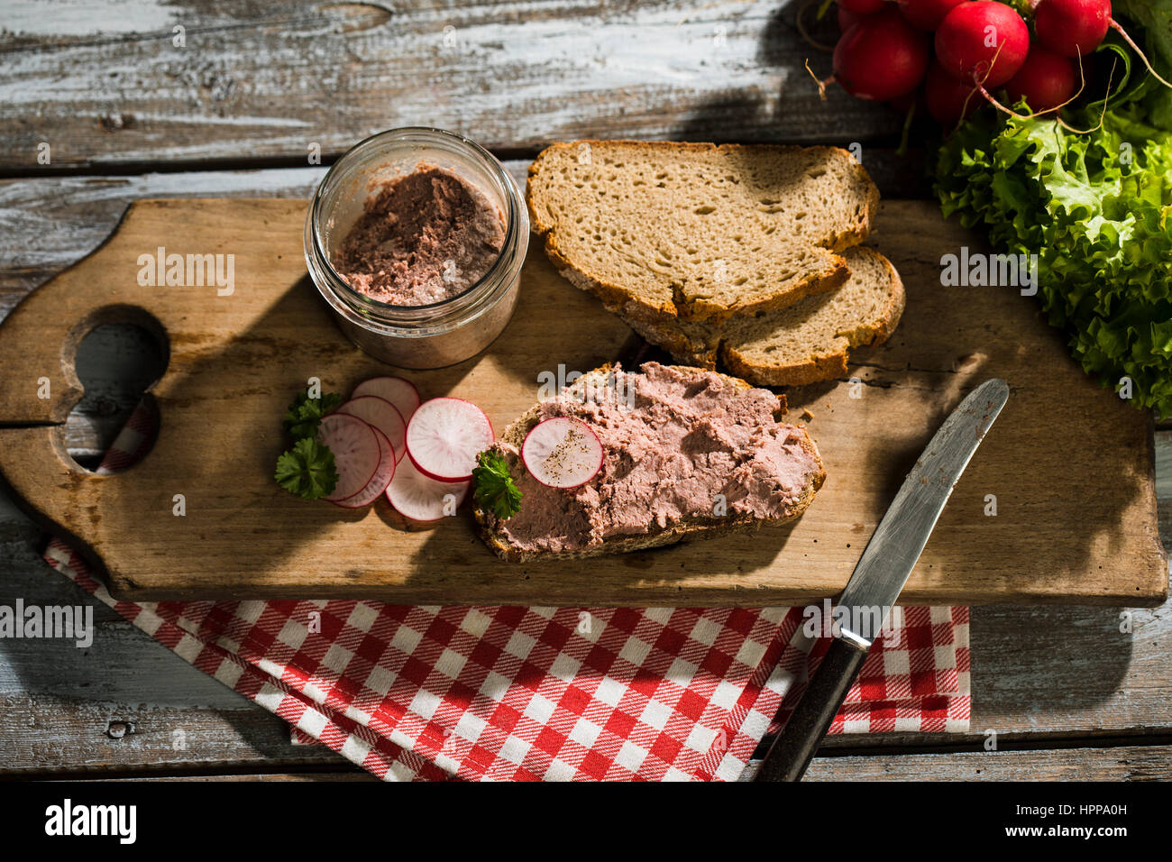 Liverwurst spread on slice of brown bread Stock Photo Alamy
