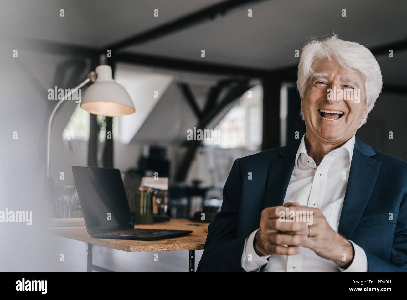 Portrait of laughing senior businessman in his office Stock Photo - Alamy