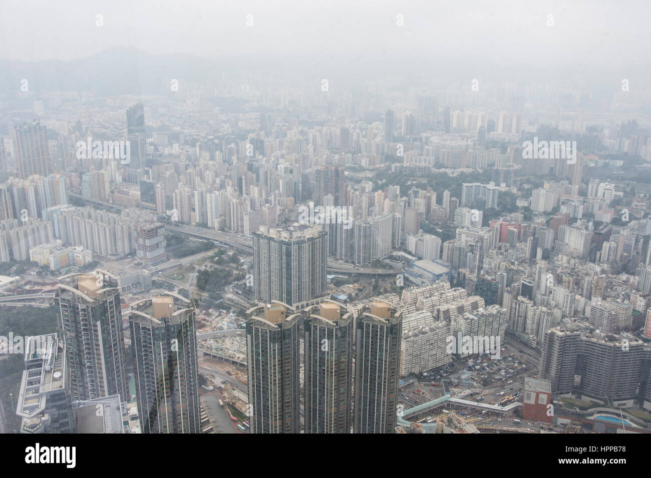 panoramic view of Hong Kong from the International Commerce Center skyscraper in a cloudy day. Stock Photo