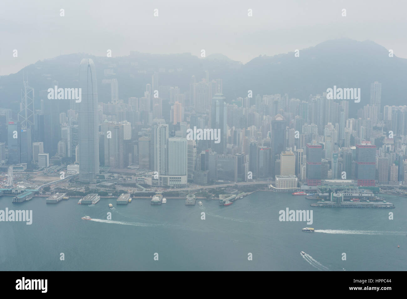 panoramic view of Hong Kong from the International Commerce Center skyscraper in a cloudy day. Stock Photo