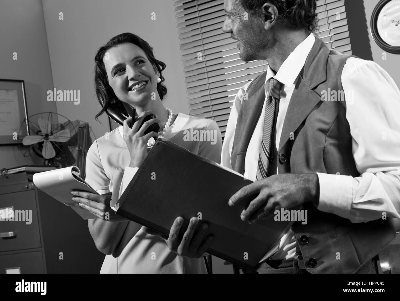 Young Secretary On The Phone And Director Working Together, 1950s ...