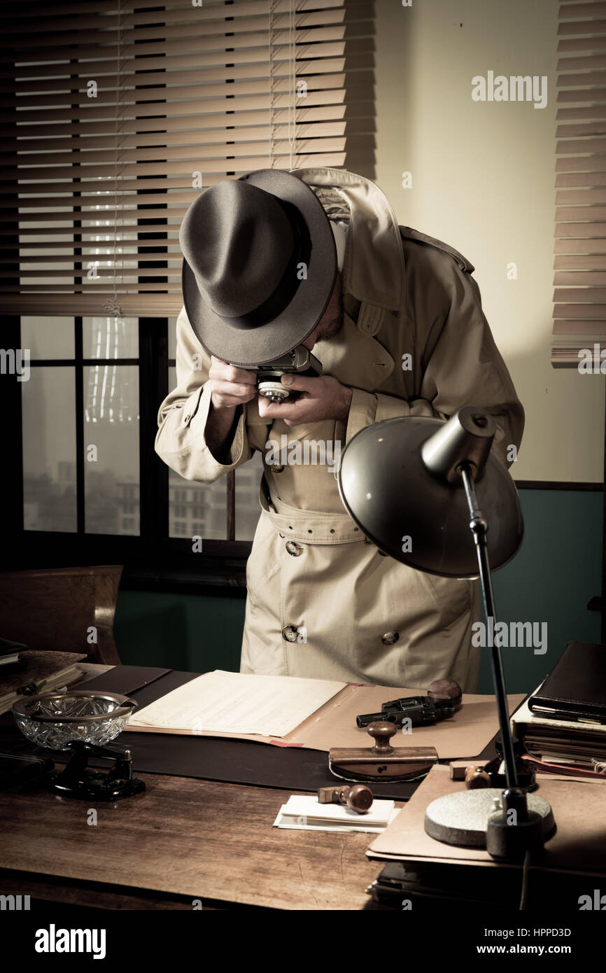 Spy agent stealing top secret data and taking pictures, 1950s style