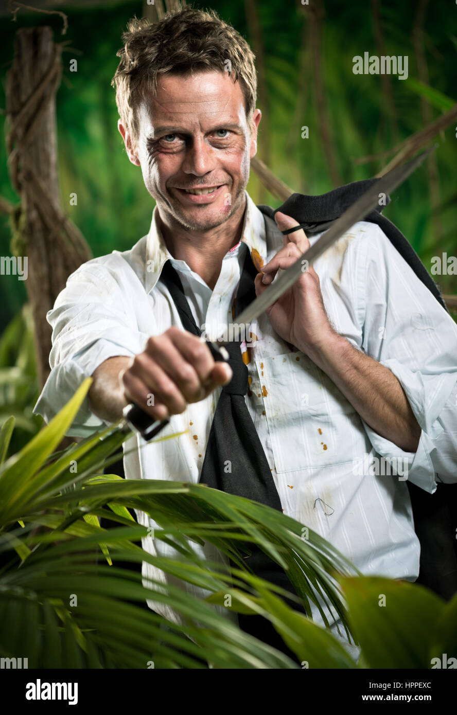 Man in jungle and machete hi-res stock photography and images - Alamy