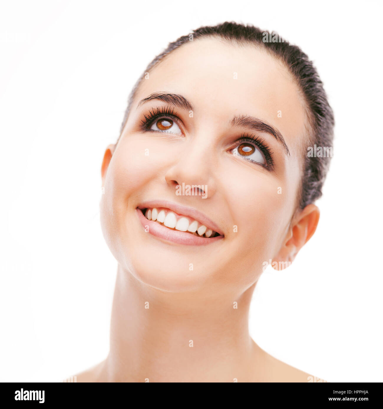 Smiling young woman posing on white background Stock Photo - Alamy
