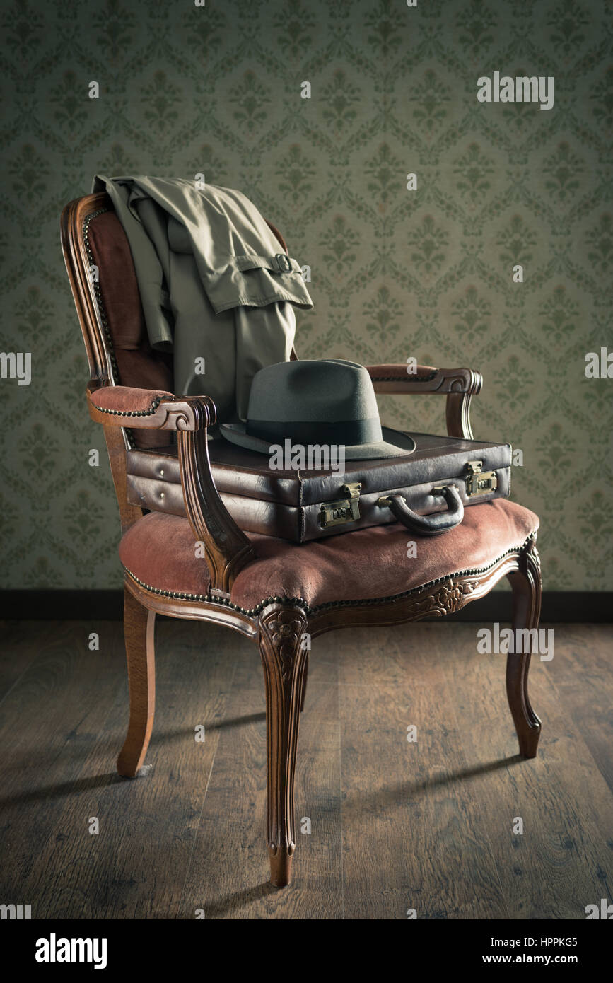 Vintage businessman clothing and briefcase on retro chair and vintage