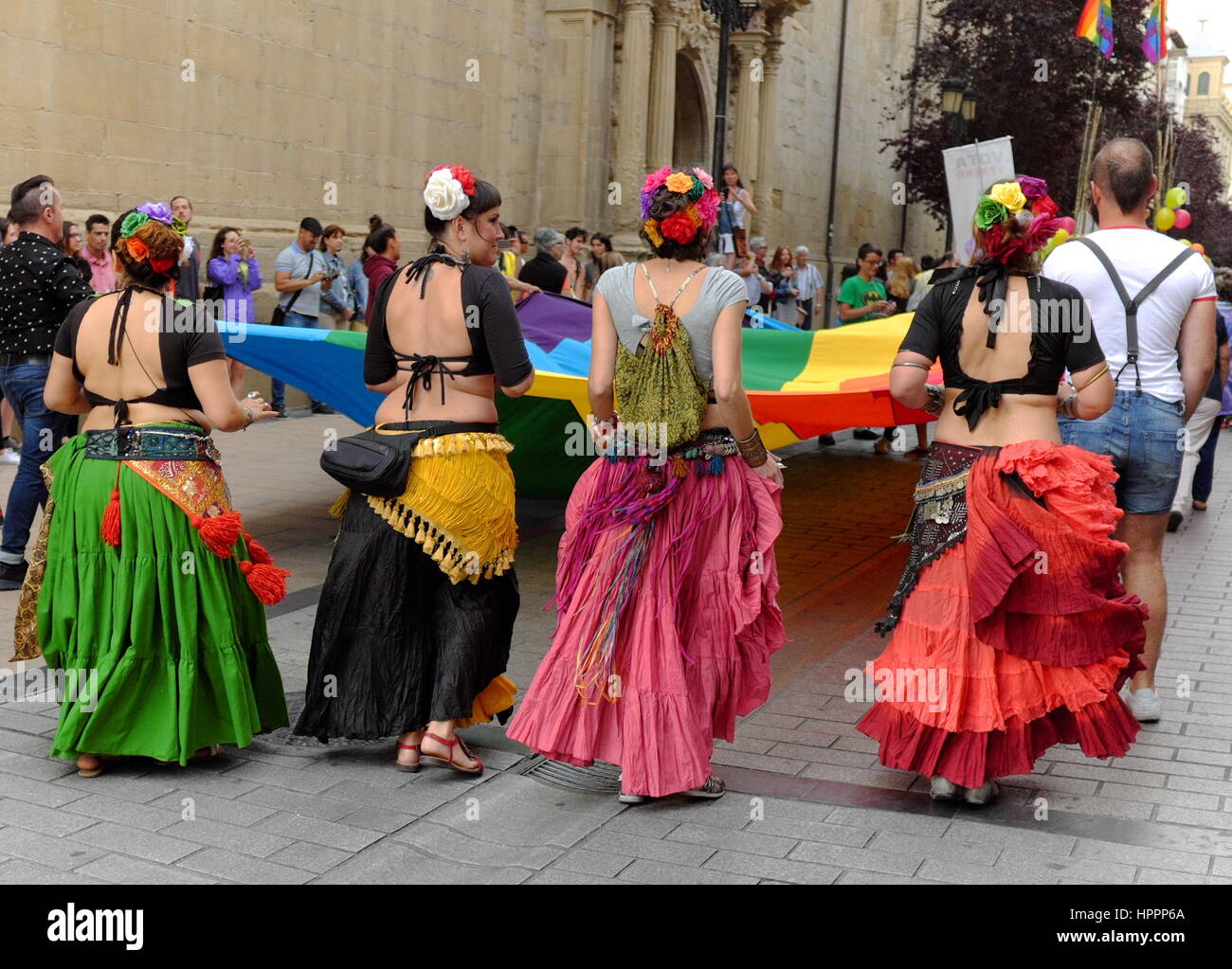 Participants in the 2017 LGBTQ Pride Parade in Logrono, Spain, carry the symbolic rainbow flag through the city. Stock Photo
