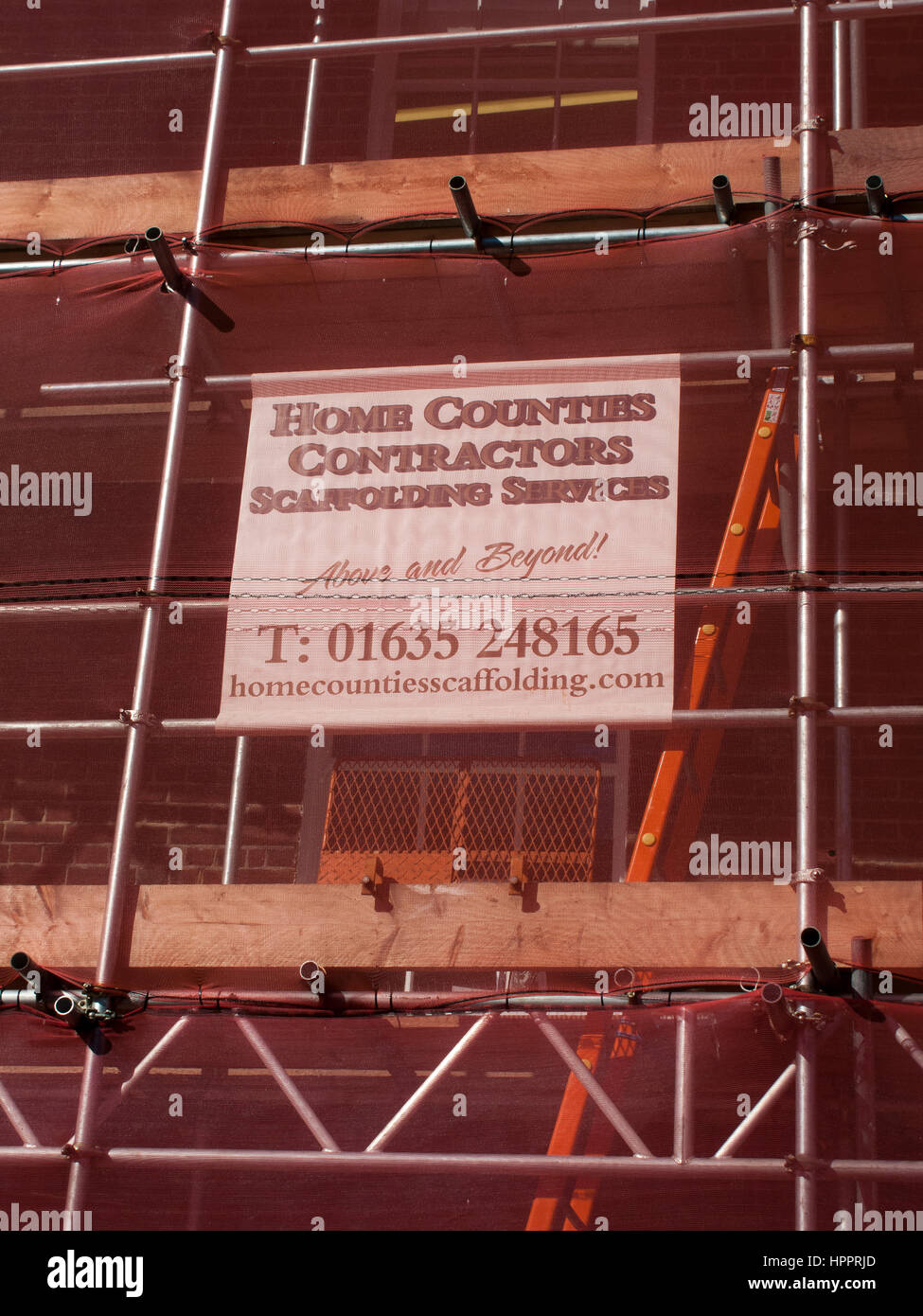 industrial scaffolding with health and safety protection mesh Stock