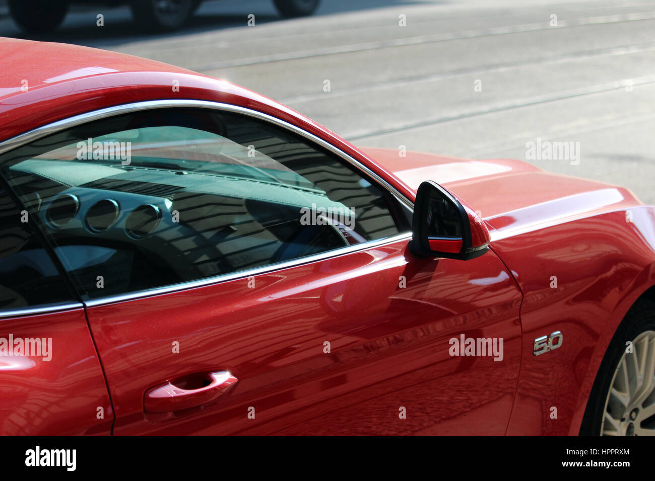 detail of red luxury car on the road Stock Photo