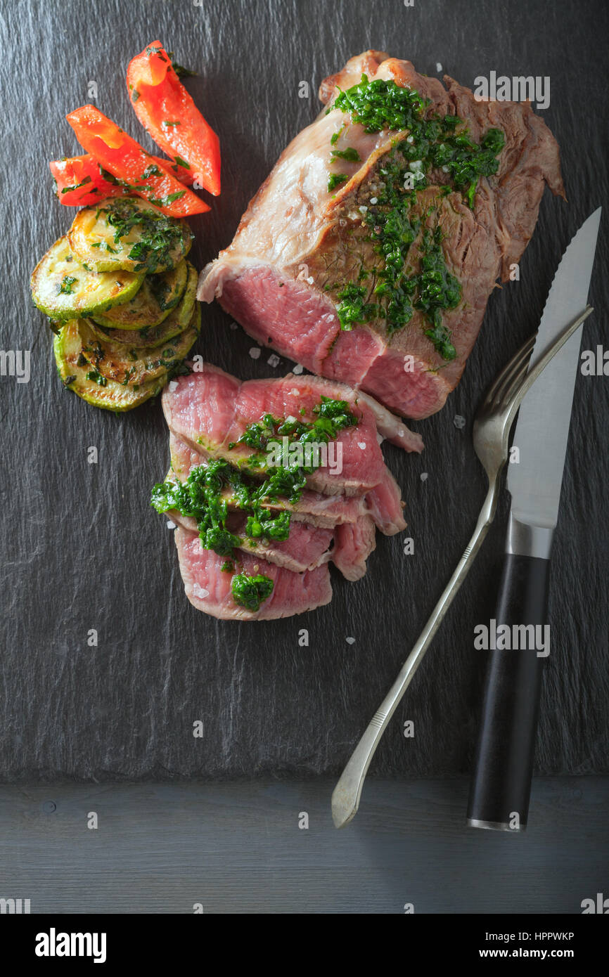 Roast Beef dinner with roasted zucchini Stock Photo